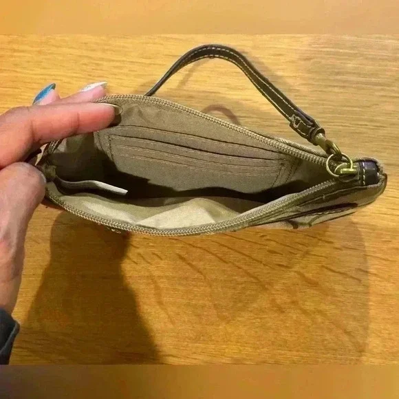 Wristlet clutch purse with interior card slots and exterior zip compartment. - Picture 4 of 5